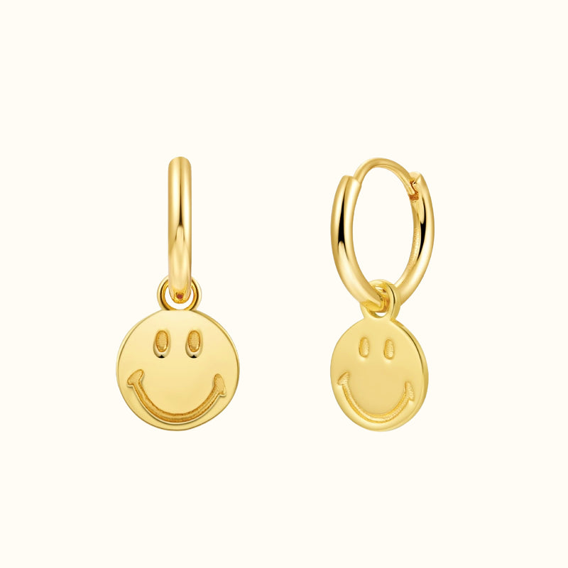 Aro de oro con cara sonriente